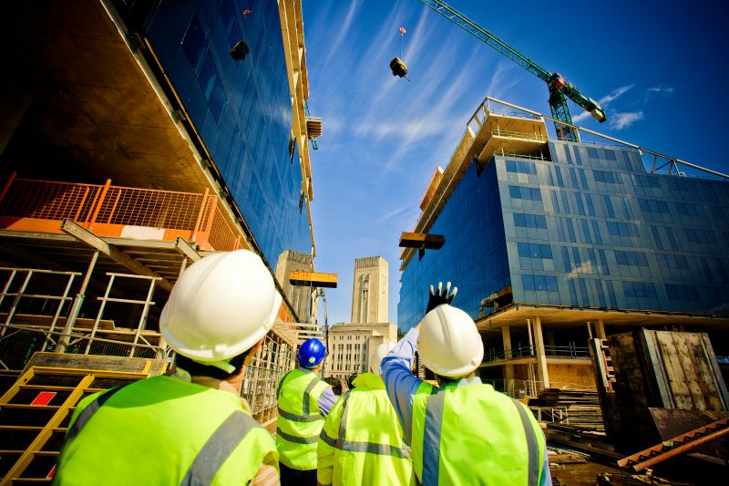 Building under construction with workers | con expo 2020 tickets | conexpo 2020: con/agg largest construction trade show