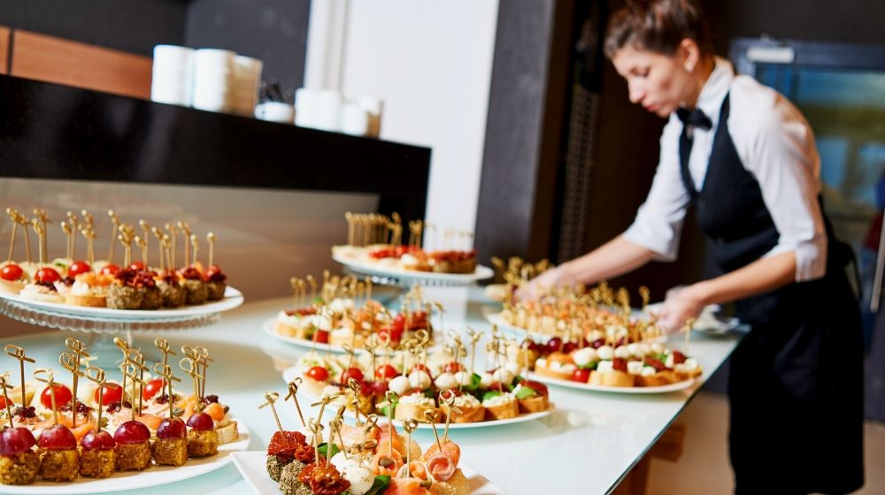 The special event company | restaurant waitress serving table food | the special event 2020 conference co-located by catersource