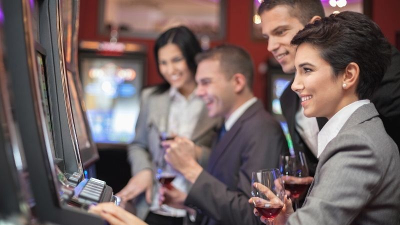 Global Gaming Expo 2021 Las Vegas | young people enjoying play slot machines | Global Gaming Expo 2021 | G2E