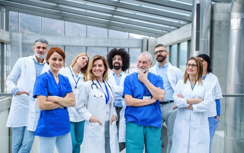 Group doctors standing on conference portrait | travcon 2021